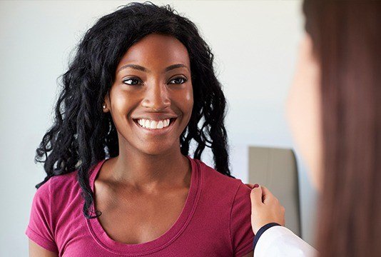 Smiling woman at dental office