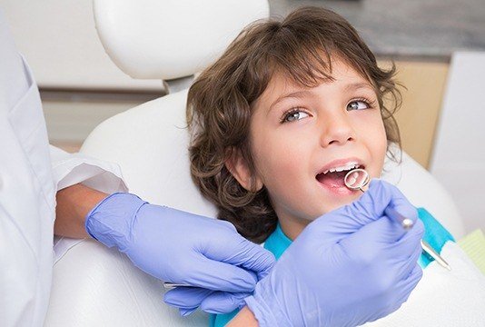 Smiling child in dental chair