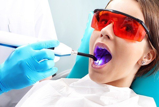 Patient receiving dental sealants