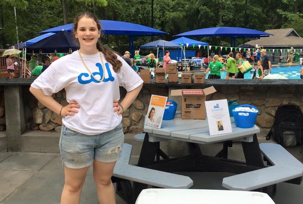 Smiling team member at community event
