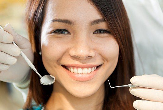 Woman receiving dental treatment