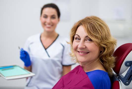 Woman visiting an emergency dentist in Raleigh