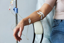 patient with IV in her arm