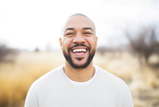 Man smiling outside