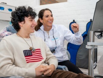 dentist showing patient monitor in Raleigh