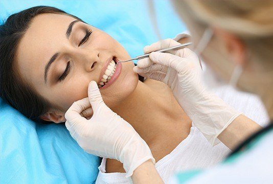 Patient receiving dental treatment