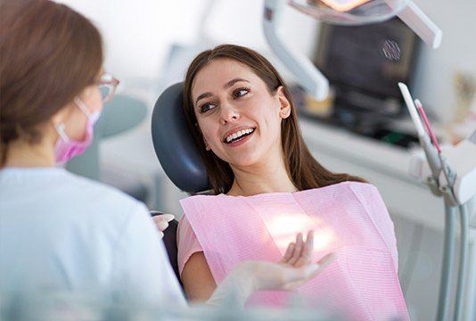 Smiling woman in dental chair