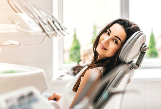 a patient smiling after undergoing sedation dentistry