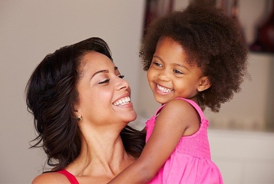 Smiling mother and daughter