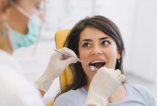 Patient receiving dental treatment