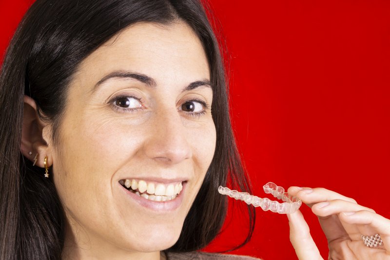 Woman with clear aligners