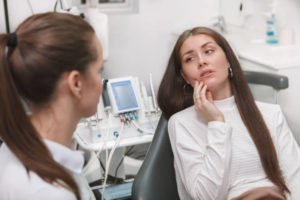 Young woman at dentist for a dental emergency