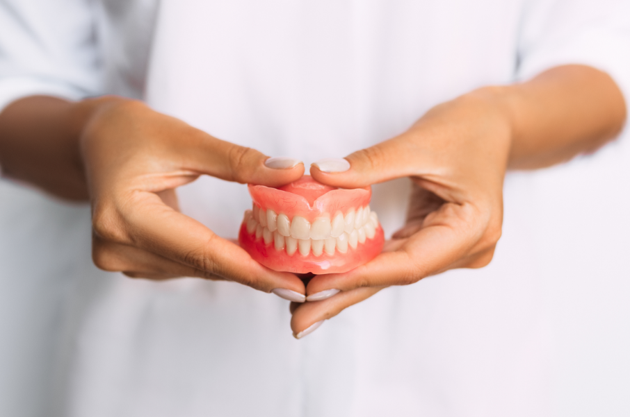 Person holding dentures